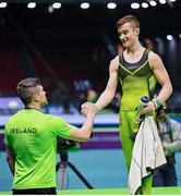 25 April 2024; James Hickey of Ireland, right, with Men's Junior coach Andrew Smith, after competing in the Men's Junior Pommel Horse qualification subdivision 1 on day two of the 2024 Men's Artistic Gymnastics European Championships at Fiera di Rimini in Rimini, Italy. Photo by Filippo Tomasi/Sportsfile
