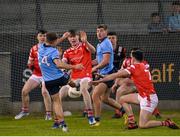 23 April 2024; Joe Quigley of Dublin has a late shot on goal blocked by Sean Callaghan of Louth during the EirGrid Leinster GAA Football U20 Championship semi-final match between Dublin and Louth at Parnell Park in Dublin. Photo by Sam Barnes/Sportsfile