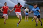 23 April 2024; Tadhg  McDonnell of Louth scores a point under pressure from Seán Kirwan of Dublin during the EirGrid Leinster GAA Football U20 Championship semi-final match between Dublin and Louth at Parnell Park in Dublin. Photo by Sam Barnes/Sportsfile