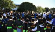 25 April 2024; Ahead of their game on Saturday in the BKT United Rugby Championship, Leinster Rugby and DHL Stormers players, coaches and staff visited and took part in a rugby session in Zimasa Primary School, pictured is players and students at Zimasa Primary School in Lunga, Cape Town. Photo by Harry Murphy/Sportsfile