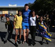 25 April 2024; Ahead of their game on Saturday in the BKT United Rugby Championship, Leinster Rugby and DHL Stormers players, coaches and staff visited and took part in a rugby session in Zimasa Primary School, pictured is Leinster player Aitzol King with students at Zimasa Primary School in Lunga, Cape Town. Photo by Harry Murphy/Sportsfile