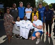 25 April 2024; Ahead of their game on Saturday in the BKT United Rugby Championship, Leinster Rugby and DHL Stormers players, coaches and staff visited and took part in a rugby session in Zimasa Primary School, pictured Cian Healy presents a jersey to school principal Fezile Mguqulwa alongside teammates Lee Barron and Aitzol King and DHL Stormers players Sazi Sandi and Lizo Gqoboka at Zimasa Primary School in Lunga, Cape Town. Photo by Harry Murphy/Sportsfile