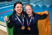 25 April 2024; Ireland swimmers Nicole Turner, joint gold medallist, left, and Dearbhaile Brady, bronze medallist, after the Women's 50m Freestyle S6 Final during day five of the Para Swimming European Championships at the Penteada Olympic Pools Complex in Funchal, Portugal. Photo by Ramsey Cardy/Sportsfile