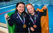 25 April 2024; Ireland swimmers Nicole Turner, joint gold medallist, left, and Dearbhaile Brady, bronze medallist, after the Women's 50m Freestyle S6 Final during day five of the Para Swimming European Championships at the Penteada Olympic Pools Complex in Funchal, Portugal. Photo by Ramsey Cardy/Sportsfile