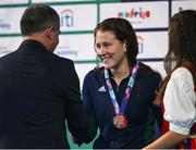 25 April 2024; Róisín Ní Ríain of Ireland is presented with her bronze medal after the Women's 400m Freestyle S13 Final during day six of the Para Swimming European Championships at the Penteada Olympic Pools Complex in Funchal, Portugal. Photo by Ramsey Cardy/Sportsfile