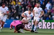 26 April 2024; Stuart McCloskey of Ulster evades the tackle of Simione Ferrari of Benetton during the United Rugby Championship match between Ulster and Benetton at Kingspan Stadium in Belfast. Photo by Ben McShane/Sportsfile