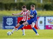 26 April 2024; Adam O’Reilly of Derry City in action against Darragh Power of Waterford during the SSE Airtricity Men's Premier Division match between Waterford and Derry City at Regional Sports Centre in Waterford. Photo by Michael P Ryan/Sportsfile