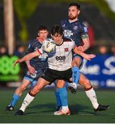 26 April 2024; Dara Keane of Dundalk in action against Jordan Flores of Bohemiansduring the SSE Airtricity Men's Premier Division match between Dundalk and Bohemians at Oriel Park in Dundalk, Louth. Photo by Stephen McCarthy/Sportsfile