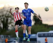 26 April 2024; Harvey Macadam of Waterford in action against Adam O’Reilly of Derry City during the SSE Airtricity Men's Premier Division match between Waterford and Derry City at Regional Sports Centre in Waterford. Photo by Michael P Ryan/Sportsfile