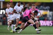 26 April 2024; Scott Wilson of Ulster is tackled by Tommaso Menocello, left, and Lorenzo Cannone of Benetton during the United Rugby Championship match between Ulster and Benetton at Kingspan Stadium in Belfast. Photo by Ben McShane/Sportsfile