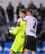 26 April 2024; Dundalk goalkeeper George Shelvey is congratulated by Andy Boyle, right, after saving a penalty from James Akintunde of Bohemians in the second half of the SSE Airtricity Men's Premier Division match between Dundalk and Bohemians at Oriel Park in Dundalk, Louth. Photo by Stephen McCarthy/Sportsfile