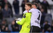 26 April 2024; Dundalk goalkeeper George Shelvey is congratulated by Andy Boyle, right, after saving a penalty from James Akintunde of Bohemians in the second half of the SSE Airtricity Men's Premier Division match between Dundalk and Bohemians at Oriel Park in Dundalk, Louth. Photo by Stephen McCarthy/Sportsfile