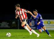 26 April 2024; Will Patching of Derry City in action against Connor Parsons of Waterford during the SSE Airtricity Men's Premier Division match between Waterford and Derry City at Regional Sports Centre in Waterford. Photo by Michael P Ryan/Sportsfile