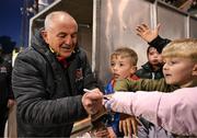 26 April 2024; Dundalk manager Noel King signs autographs for supporters after the SSE Airtricity Men's Premier Division match between Dundalk and Bohemians at Oriel Park in Dundalk, Louth. Photo by Stephen McCarthy/Sportsfile