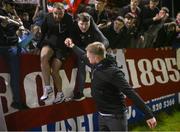 26 April 2024; Shelbourne manager Damien Duff pulls supporter Ciaran Harmon out of the crowd to join the team after the SSE Airtricity Men's Premier Division match between Shelbourne and St Patrick's Athletic at Tolka Park in Dublin. Photo by David Fitzgerald/Sportsfile