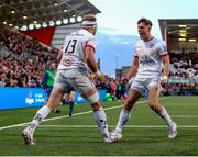 26 April 2024; Will Addison of Ulster celebrates with teammate Ethan McIlroy, right, after scoring their side's fourth try after scoring their side's fourth try during the United Rugby Championship match between Ulster and Benetton at Kingspan Stadium in Belfast. Photo by John Dickson/Sportsfile