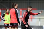 27 April 2024; Bohemians manager Ken Kiernan, right, directs players in the warm-up before the SSE Airtricity Women's Premier Division match between Bohemians and Treaty United at Dalymount Park in Dublin. Photo by Shauna Clinton/Sportsfile