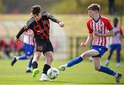 27 April 2024; Ashley Okeowo of Bohemians has a shot blocked by Jack Cregan of Treaty United during the EA SPORTS LOI Academy MU15 development weekend at FAI Headquarters in Abbotstown, Dublin. Photo by Seb Daly/Sportsfile