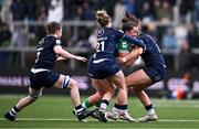 27 April 2024; Enya Breen of Ireland is tackled by Mairi McDonald, left, and Helen Nelson of Scotland during the Women's Six Nations Rugby Championship match between Ireland and Scotland at the Kingspan Stadium in Belfast. Photo by Ben McShane/Sportsfile