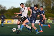 26 April 2024; Robbie Benson of Dundalk is tackled by James Clarke of Bohemians during the SSE Airtricity Men's Premier Division match between Dundalk and Bohemians at Oriel Park in Dundalk, Louth. Photo by Stephen McCarthy/Sportsfile