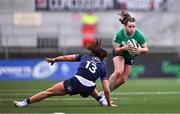 27 April 2024; Méabh Deely of Ireland gets past Emma Orr of Scotland during the Women's Six Nations Rugby Championship match between Ireland and Scotland at the Kingspan Stadium in Belfast. Photo by Ben McShane/Sportsfile