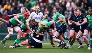 27 April 2024; Sam Monaghan of Ireland is tackled by Christine Belisle, left, and Alex Stewart of Scotland during the Women's Six Nations Rugby Championship match between Ireland and Scotland at the Kingspan Stadium in Belfast. Photo by Ben McShane/Sportsfile