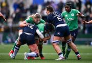 27 April 2024; Aoibheann Reilly of Ireland is tackled by Lisa Thompson, left, and Louise McMillan of Scotland during the Women's Six Nations Rugby Championship match between Ireland and Scotland at the Kingspan Stadium in Belfast. Photo by Ben McShane/Sportsfile