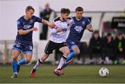26 April 2024; Scott High of Dundalk in action against Brian McManus, left, and Adam McDonnell of Bohemians during the SSE Airtricity Men's Premier Division match between Dundalk and Bohemians at Oriel Park in Dundalk, Louth. Photo by Stephen McCarthy/Sportsfile