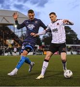 26 April 2024; Zak Bradshaw of Dundalk in action against Filip Piszczek of Bohemians during the SSE Airtricity Men's Premier Division match between Dundalk and Bohemians at Oriel Park in Dundalk, Louth. Photo by Stephen McCarthy/Sportsfile