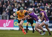 27 April 2024; Niall McKenna of Antrim in action against Niall Murphy, left, and Shane Reck of Wexford during the Leinster GAA Hurling Senior Championship Round 2 match between Antrim and Wexford at Corrigan Park in Belfast. Photo by Sam Barnes/Sportsfile