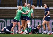27 April 2024; Katie Corrigan of Ireland celebrates with teammates Neve Jones, left, and Aoibheann Reilly, right, after scoring their side's first try during the Women's Six Nations Rugby Championship match between Ireland and Scotland at the Kingspan Stadium in Belfast. Photo by Ben McShane/Sportsfile