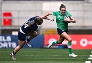 27 April 2024; Béibhinn Parsons of Ireland evades the tackle of Coreen Grant of Scotland during the Women's Six Nations Rugby Championship match between Ireland and Scotland at the Kingspan Stadium in Belfast. Photo by Ben McShane/Sportsfile