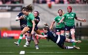 27 April 2024; Béibhinn Parsons of Ireland evades the tackle of Meryl Smith of Scotland during the Women's Six Nations Rugby Championship match between Ireland and Scotland at the Kingspan Stadium in Belfast. Photo by Ben McShane/Sportsfile