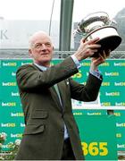 27 April 2024; Willie Mullins with his trophy after winning the British Jump Trainers' Championship 2023/24 and becoming the first Irish based champion to achieve it in 70 years at Sandown Park in Surrey, England. Photo by Steven Cargill/Sportsfile