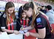 27 April 2024; Sarah Power of Bohemians signs autographs for supporters after her side's victory in  the SSE Airtricity Women's Premier Division match between Bohemians and Treaty United at Dalymount Park in Dublin. Photo by Shauna Clinton/Sportsfile