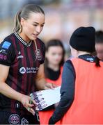 27 April 2024; Fiona Donnelly of Bohemians signs autographs for supporters after her side's victory in  the SSE Airtricity Women's Premier Division match between Bohemians and Treaty United at Dalymount Park in Dublin. Photo by Shauna Clinton/Sportsfile
