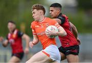 27 April 2024; Conor Turbitt of Armagh in action against Finn McElroy of Down during the Ulster GAA Football Senior Championship semi-final match between Down and Armagh at St Tiernach's Park in Clones, Monaghan. Photo by Stephen McCarthy/Sportsfile