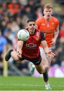 27 April 2024; Finn McElroy of Down in action against Conor Turbitt of Armagh during the Ulster GAA Football Senior Championship semi-final match between Down and Armagh at St Tiernach's Park in Clones, Monaghan. Photo by Stephen McCarthy/Sportsfile