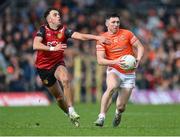 27 April 2024; Oisin Conaty of Armagh in action against Barry O'Hagan of Down during the Ulster GAA Football Senior Championship semi-final match between Down and Armagh at St Tiernach's Park in Clones, Monaghan. Photo by Stephen McCarthy/Sportsfile