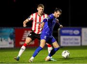 26 April 2024; Connor Parsons of Waterford in action against Ronan Boyce of Derry City during the SSE Airtricity Men's Premier Division match between Waterford and Derry City at Regional Sports Centre in Waterford. Photo by Michael P Ryan/Sportsfile