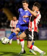 26 April 2024; Ben McCormack of Waterford in action against Adam O’Reilly of Derry City during the SSE Airtricity Men's Premier Division match between Waterford and Derry City at Regional Sports Centre in Waterford. Photo by Michael P Ryan/Sportsfile