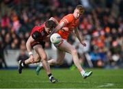27 April 2024; Ryan McEvoy of Down in action against Conor Turbitt of Armagh during the Ulster GAA Football Senior Championship semi-final match between Down and Armagh at St Tiernach's Park in Clones, Monaghan. Photo by Stephen McCarthy/Sportsfile