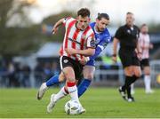 26 April 2024; Danny Mullen of Derry City in action against Connor Parsons of Waterford during the SSE Airtricity Men's Premier Division match between Waterford and Derry City at Regional Sports Centre in Waterford. Photo by Michael P Ryan/Sportsfile