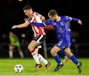 26 April 2024; Michael Duffy of Derry City in action against Rowan McDonald of Waterford during the SSE Airtricity Men's Premier Division match between Waterford and Derry City at Regional Sports Centre in Waterford. Photo by Michael P Ryan/Sportsfile