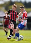 27 April 2024; Alfie O'Hanlon of Bohemians in action against Conor O'Mahony of Treaty United during the EA SPORTS LOI Academy MU15 development weekend at FAI Headquarters in Abbotstown, Dublin. Photo by Seb Daly/Sportsfile
