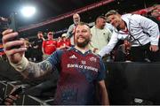 27 April 2024; RG Snyman of Munster takes a selfie with the fans after the United Rugby Championship match between Emirates Lions and Munster at Emirates Airline Park in Johannesburg, South Africa. Photo by Shaun Roy/Sportsfile
