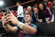 27 April 2024; Jack Crowley of Munster takes a selfie with the fans after the United Rugby Championship match between Emirates Lions and Munster at Emirates Airline Park in Johannesburg, South Africa. Photo by Shaun Roy/Sportsfile