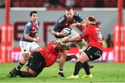 27 April 2024; RG Snyman of Munster is tackled by Asenathi Ntlabakanye and PJ Botha of Emirates Lions during the United Rugby Championship match between Emirates Lions and Munster at Emirates Airline Park in Johannesburg, South Africa. Photo by Shaun Roy/Sportsfile