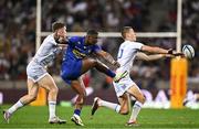 27 April 2024; Warrick Gelant of DHL Stormers kicks under pressure from Rob Russell and Sam Prendergast of Leinster during the United Rugby Championship match between DHL Stormers and Leinster at the DHL Stadium in Cape Town, South Africa. Photo by Harry Murphy/Sportsfile