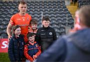 27 April 2024; Rian O'Neill of Armagh poses with supporters after the Ulster GAA Football Senior Championship semi-final match between Down and Armagh at St Tiernach's Park in Clones, Monaghan. Photo by Stephen McCarthy/Sportsfile